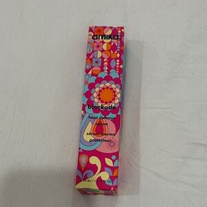 amika heat defense serum - pink and turquoise patterned packaging